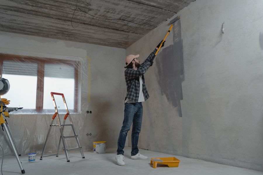 Handyman painting an interior wall