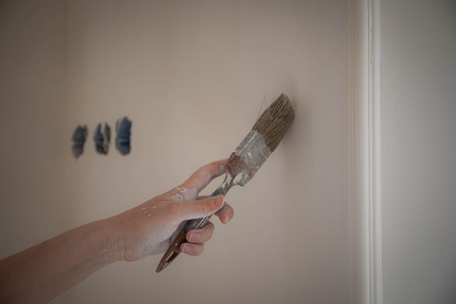Hand painting a wall for a home touch-up